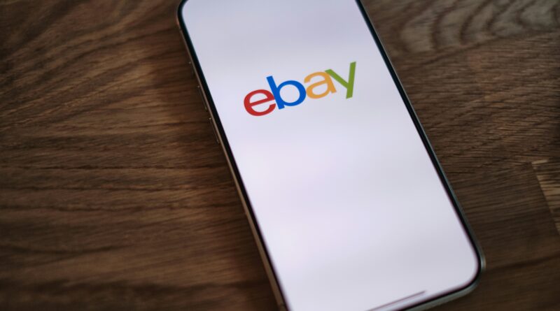 hmrc side hustle tax ebay vinted showing a person selling clothes online on a phone with a tax form in the background representing hmrc digital platform reporting rules for online sellers