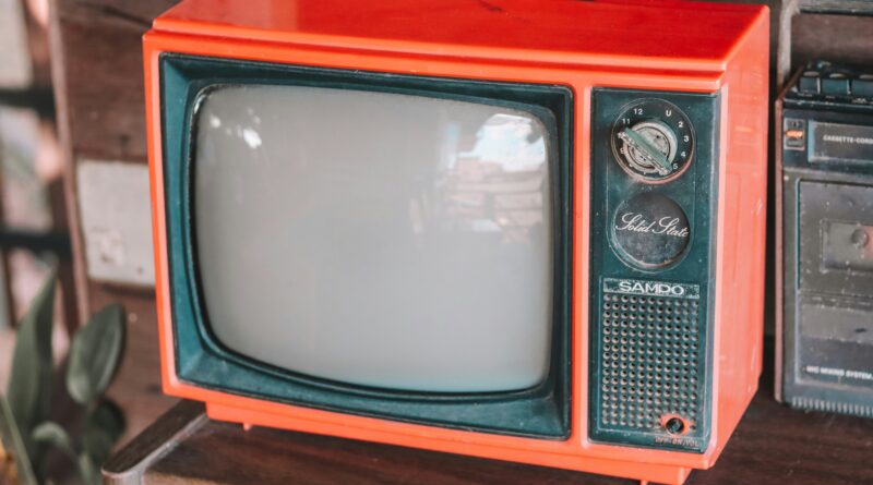 do students need a tv licence showing a student watching BBC iPlayer on a laptop in university halls representing student TV licence rules halls accommodation private house battery loophole cost and how to get a refund