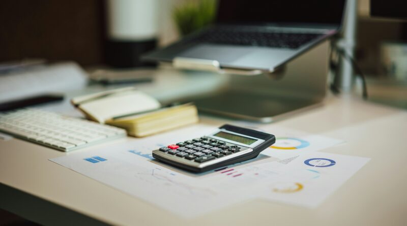 hmrc pension tax p55 form showing a person completing an hmrc tax refund form for a pension withdrawal representing emergency tax on pension withdrawals and how to claim a refund
