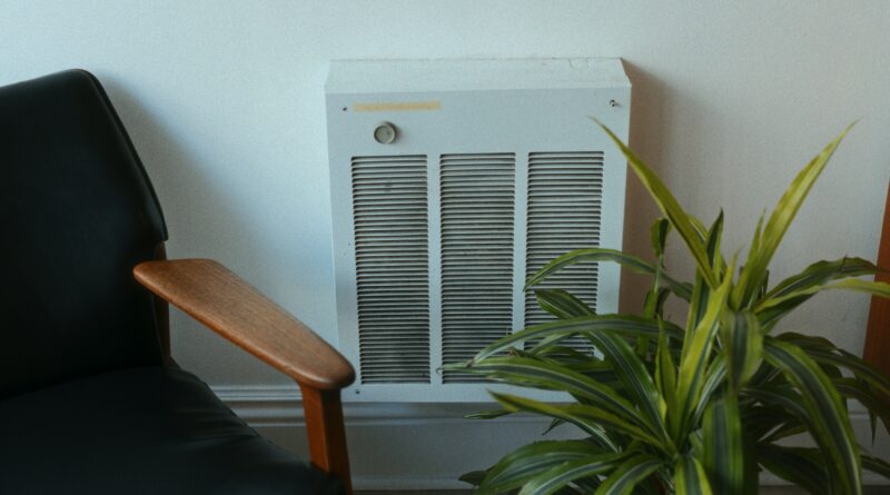 radiator cover with storage showing a white hallway radiator cover with shoe storage compartment below in a modern UK hallway representing the best radiator covers with storage for hallways and living rooms
