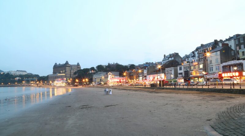 things to do in Scarborough showing Scarborough Castle on the headland overlooking South Bay beach and the harbour in North Yorkshire representing the best attractions and activities in Scarborough