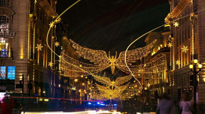 London Christmas lights 2025 showing the spectacular illuminations on Oxford Street with shoppers below representing the best Christmas light displays in London 2025 including switch-on dates and walking routes