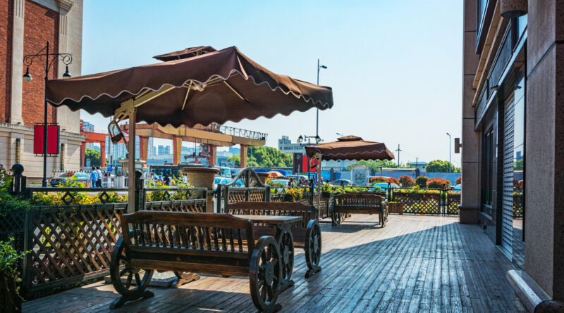 cafes in colchester town centre showing independent coffee shop with outdoor seating on cobbled street near colchester castle