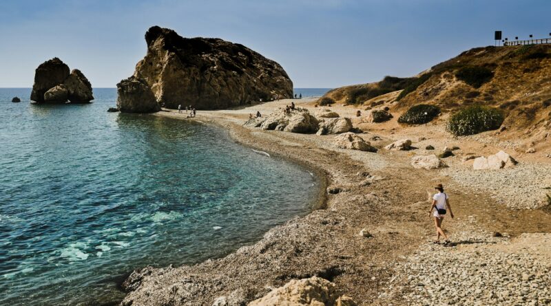 things to do in Cyprus showing the ancient Tombs of the Kings archaeological site near Paphos with carved stone burial chambers against a blue Mediterranean sky representing the top historical attractions and things to see in Cyprus